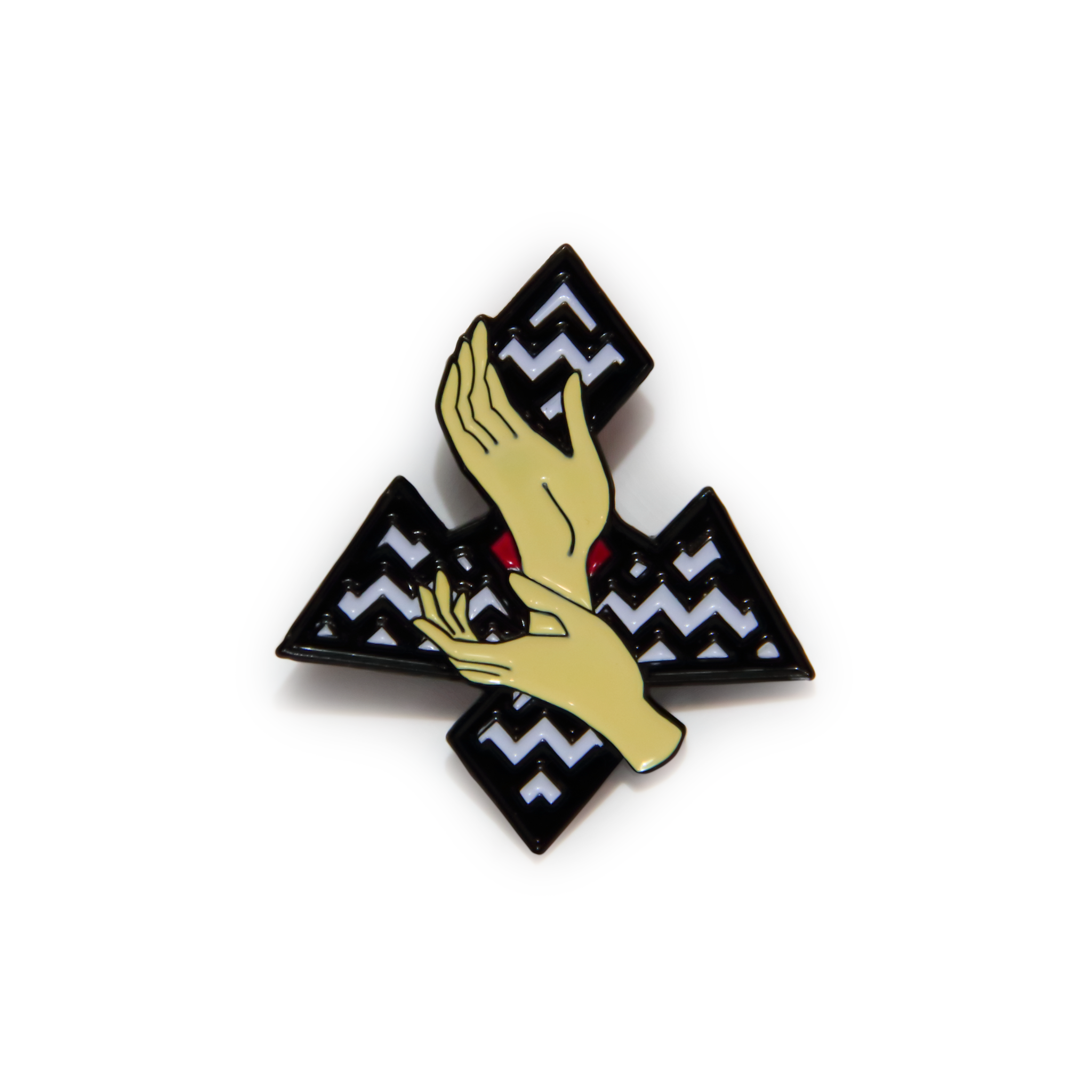 lapel pin with two hands in front of a zig zag background