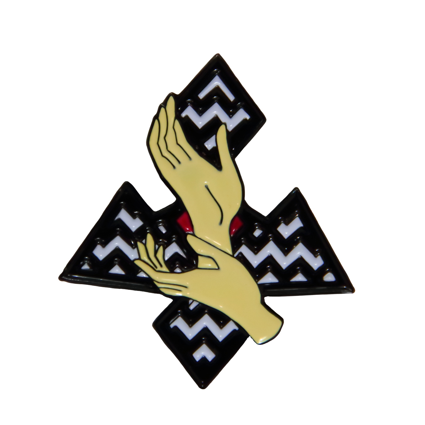 a lapel pin with two hands in front of a zig zag background